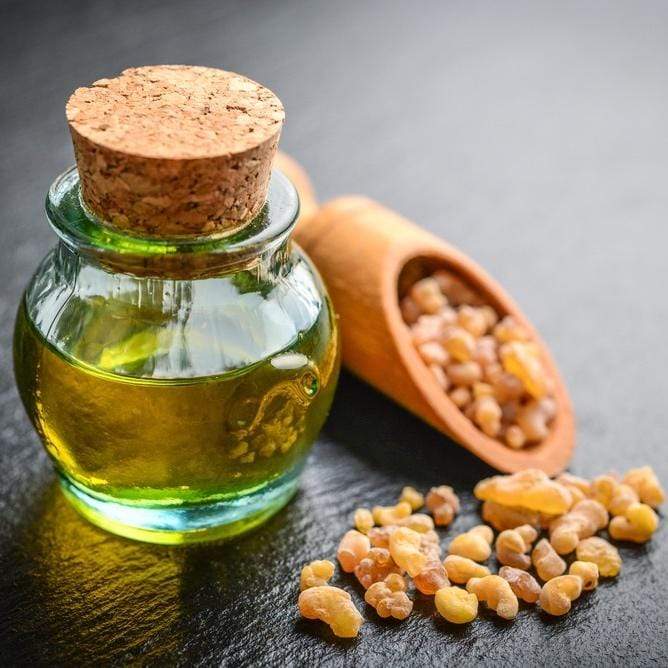 Myrrh Essential Oil in an artisan glass jar with Myrrh resin by its side